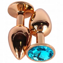 Золотистая гладкая анальная пробка с голубым кристаллом - 7,5 см. Золотистая гладкая анальная пробка с голубым кристаллом - 7,5 см.