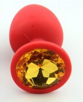 Красная анальная втулка с желтым кристаллом - 7,3 см.
