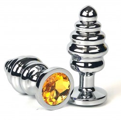 Серебристая ребристая анальная пробка с оранжевым кристаллом - 6 см. Серебристая ребристая анальная пробка с оранжевым кристаллом - 6 см.